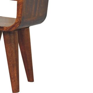 Close detail of the chestnut bedside table's curved lower body and two tapered, splayed legs.