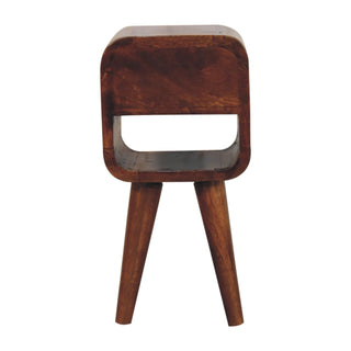 Back view of the chestnut bedside cabinet showing the solid rear panel, open shelf, and tapered legs.