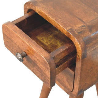 Curved chestnut bedside cabinet with the top drawer pulled open, revealing the wooden drawer box interior.