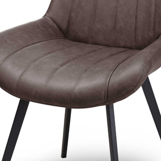 Close-up of the coffee faux leather seat base, showing the stitching and the black square-section metal legs.