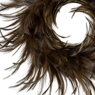Close up detail showing the layered texture of the dark brown and fawn coloured feathers on the wreath.