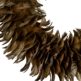 Close-up detail of the dense, layered texture of the dark fawn feathers forming the wreath.