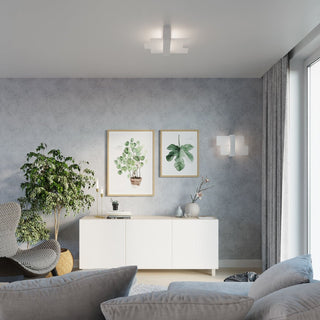 Ceiling light fixture installed in a contemporary grey living room with matching wall light and botanical prints.