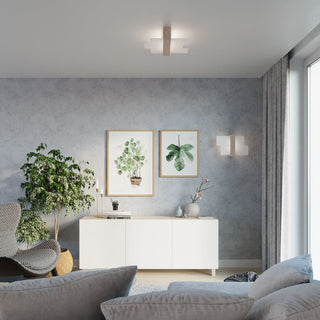 Styled interior scene showing the ceiling light and coordinating wall light fixture.
