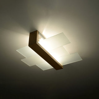Illuminated frosted glass panels and natural wood beam mounted flush to the ceiling.