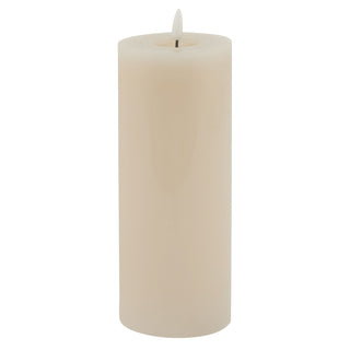 Taupe flameless pillar candle with a melt effect top and a glowing LED flame. Plain white background.