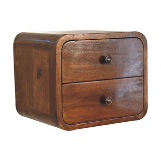 Close view of the deep chestnut finish on the floating bedside cabinet, highlighting the wood grain.
