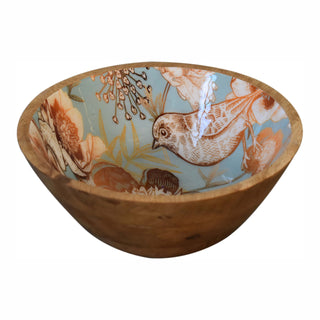 Angled view of one wooden bowl displaying the exterior grain and the glossy teal interior with a detailed bird motif.