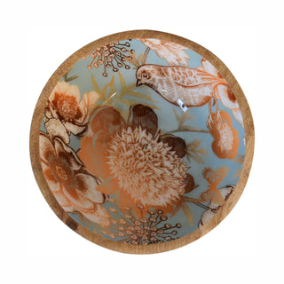 Overhead shot of one bowl showing the wooden rim and the glossy teal interior with detailed floral and bird pattern.