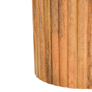 Detail of the rich brown wooden base, featuring vertical fluting and the natural grain texture.