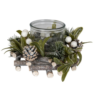Frosted candle wreath base with a central glass jar, surrounded by rustic wood, pinecones, pine needles, and white berries.