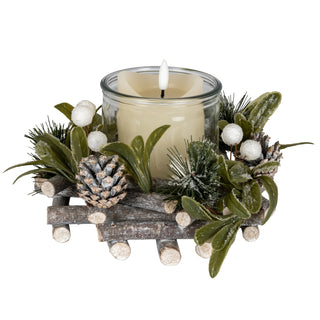 Frosted mistletoe and pine wreath with a central glass jar holding a faux flickering candle.
