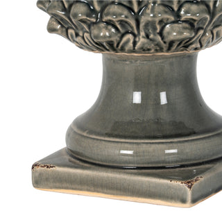 Detail of the grey ceramic sculpture base and pedestal, highlighting the crackle glaze finish.