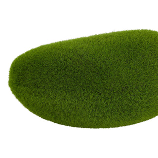 Detailed view of the bright green texture of the faux moss, showing short, dense fibres.
