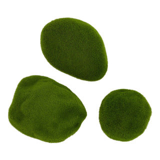 Three pieces of bright green artificial moss on a white background, showing varied shapes and texture.