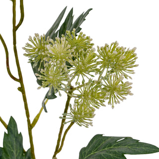 Close-up detail of the artificial lime green starburst blooms and dark green serrated foliage.