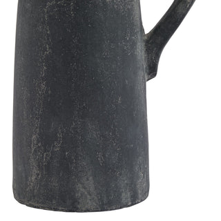 Close detail of the distressed grey ceramic surface, showing the lower body, base, and handle connection.