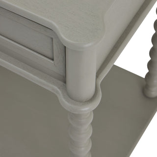 Close detail of the grey console table showing the bobbin leg joint connecting the upper frame and lower shelf.