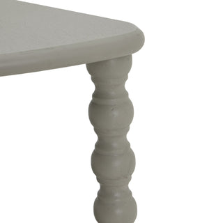 Close-up of the grey painted bobbin turned leg connecting directly beneath the console tabletop.