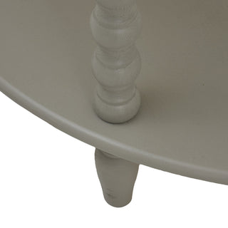 Detail of the grey painted lower shelf edge, showing the bobbin leg connection and the small tapered foot below.