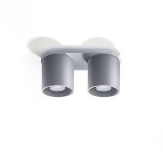 Angled view of the grey ceiling light showing the cylindrical shades and recessed LED bulbs.