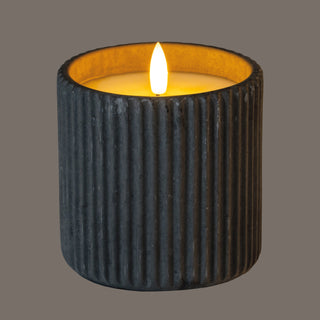 Close-up of the grey ribbed pot, showing the illuminated LED flame and the warm glow on the inner rim.
