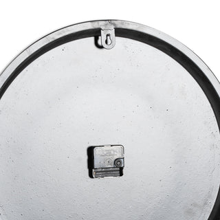 Rear view of the grey wall clock showing the quartz movement and hanging bracket.