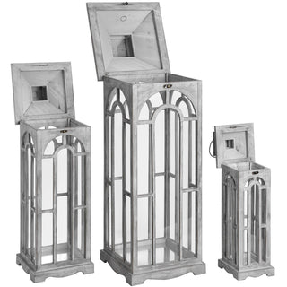 Three grey wooden lanterns of different sizes displayed with their hinged lids open.