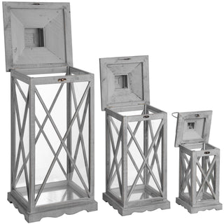 Set of three graduated grey wooden lanterns displayed with their hinged roofs open.