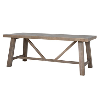 Light wood dining table shown front-on, highlighting the tapered A-frame legs and central X-frame support.