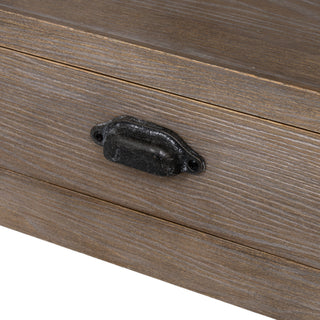 Close-up detail of the distressed dark metal cup handle attached to the washed oak drawer front.