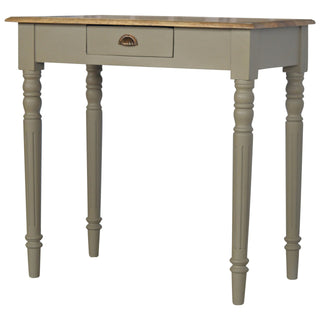 Single central drawer with an antique brass-coloured shell pull handle against the taupe painted frame.