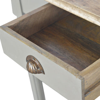Open drawer detail showing the dark natural wood interior and the antique brass shell pull handle.