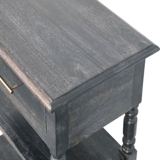 Detail of the dark wood tabletop showing the distressed finish, grain texture, and moulded edge.