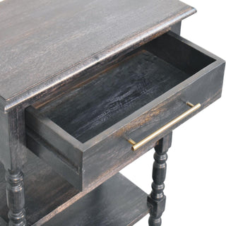 Dark wood side table close-up showing the drawer open, revealing the internal storage space and brass bar pull.