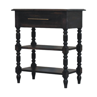Dark wood side table with turned legs, one drawer with a brass pull, and two lower storage shelves.