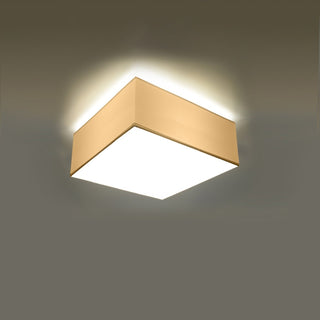 Illuminated square ceiling fixture showing upward spill light and bright downward diffuser.