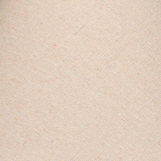 Close-up texture of the lamp's beige linen shade, showing the tight diagonal weave and natural slubs.