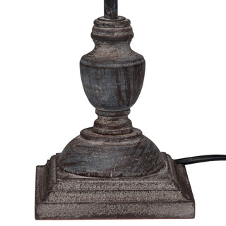 Close-up of the square base and urn-shaped stem detail, showing the distressed grey metal finish.