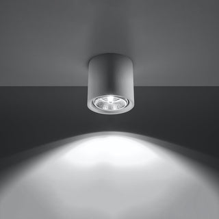 White ceramic ceiling light switched on, projecting a bright, focused beam downwards.