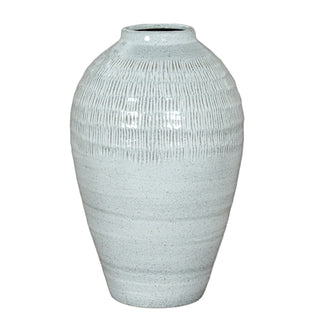 Light blue speckled ceramic vase with textured vertical line pattern on the upper half.