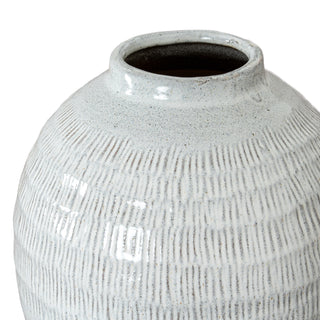 Detail shot showing the rough texture, speckled white glaze, and dark clay visible in the vertical grooves.