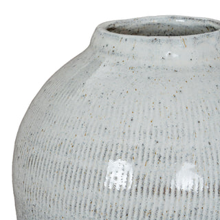Curved upper section of the light grey ceramic vase, showing the speckled glaze and subtle vertical texture.