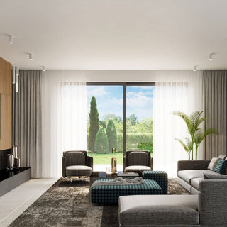 Contemporary living room scene showing multiple white ceiling lamps providing illumination.