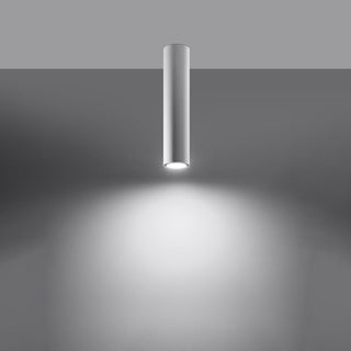 White cylindrical ceiling light fixture casting a bright spotlight beam downwards.