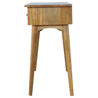 Profile view of the light wood console table showing the depth of the frame and the angled, tapered legs.