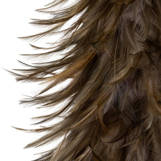 Detailed view of the layered dark brown and fawn feathers forming the tree shape.