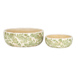 Two clover ceramic bowls, large and small, side-by-side to show the difference in size.