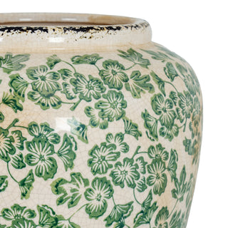 Detail shot of the vase rim and body, highlighting the crackle glaze and dense green clover pattern.