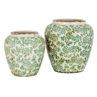 Large ceramic clover vase paired with a smaller matching vase on a white background.